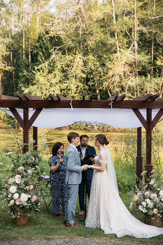 Kingston House wedding beneath arbor